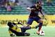 KUALA LUMPUR, MALAYSIA - AUGUST 10: Martin Montoya of Barcelona FC is tackled by S. Kunanalan of Malaysia during the friendly match between FC Barcelona and Malaysia at the Shah Alam Stadium on August 10, 2013 in Kuala Lumpur, Malaysia. (Photo by Stanle
