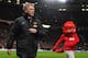 MANCHESTER, ENGLAND - JANUARY 01: Manchester United Manager David Moyes walks with mascot Fred the Red prior to the Barclays Premier League match between Manchester United and Tottenham Hotspur at Old Trafford on January 1, 2014 in Manchester, England.