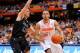 SYRACUSE, NY - DECEMBER 20: Tyler Ennis #11 of the Syracuse Orange drives to the basket around the defense of Jorge Perez-Laham #12 of the High Point Panthers during the first half at the Carrier Dome on December 20, 2013 in Syracuse, New York. (Photo b