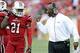 September 2, 2012; Louisville, KY USA; Louisville Cardinals head coach Charlie Strong talks with cornerback Adrian Bushell (21) during the second half of play against the Kentucky Wildcats at Papa John's Cardinals Stadium. Louisville defeated Kentucky