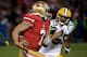 SAN FRANCISCO, CA - JANUARY 12: Quarterback Colin Kaepernick #7 of the San Francisco 49ers runs the ball against inside linebacker Brad Jones #59 of the Green Bay Packers during the NFC Divisional Playoff Game at Candlestick Park on January 12, 2013 in S