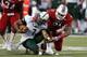 LOUISVILLE, KY - OCTOBER 20: Marcus Smith #91 of the Louisville Cardinals sacks B.J. Daniels #7 of the South Florida Bulls during the game at Papa John's Cardinal Stadium on October 20, 2012 in Louisville, Kentucky. Louisville won 27-25. (Photo by Joe Rob