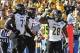 Jan 4, 2014; Frisco, TX, USA; Towson Tigers running back Terrance West (28) celebrates a touchdown with offensive linesman Sam Evans (61) and offensive tackle Eric Pike (71) in the first quarter against the North Dakota State Bison at Toyota Stadium. Mand