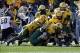 Jan 4, 2014; Frisco, TX, USA; Towson Tigers running back Darius Victor (27) is tackled by North Dakota State Bison linebacker Travis Beck (52) and his teammates in the first quarter at Toyota Stadium. Mandatory Credit: Tim Heitman-USA TODAY Sports
