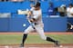 TORONTO, CANADA - AUGUST 26: Brett Gardner #11 of the New York Yankees hits a single in the first inning during MLB game action against the Toronto Blue Jays on August 26, 2013 at Rogers Centre in Toronto, Ontario, Canada. (Photo by Tom Szczerbowski/Getty