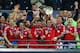 LONDON, ENGLAND - MAY 25: Bastian Schweinsteiger, Thomas Mueller and Philipp Lahm of Bayern Muenchen lift the trophy in celebration alongside team mates after victory in the UEFA Champions League final match between Borussia Dortmund and FC Bayern Muench
