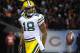 CHICAGO, IL - DECEMBER 29: Randall Cobb #18 of the Green Bay Packers reacts after catching the game winning catch during the fourth quarter against the Chicago Bears defends him on December 29, 2013 at Soldier Field in Chicago, Illinois. The Green Bay Pac