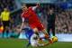 LIVERPOOL, ENGLAND - DECEMBER 29: Luke Shaw of Southampton is tackled by Steven Naismith of Everton during the Barclays Premier League match between Everton and Southampton at Goodison Park on December 29, 2013 in Liverpool, England. (Photo by Paul Thom