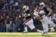 AUBURN, AL - NOVEMBER 30: Tre Mason #21 of the Auburn Tigers tries to avoid the tackle of Trey DePriest #33 of the Alabama Crimson Tide in the first quarter at Jordan-Hare Stadium on November 30, 2013 in Auburn, Alabama. (Photo by Kevin C. Cox/Getty Ima