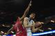 LONDON, ENGLAND - MAY 12: Nikola Mirotic of Real Madrid tussles with Kyle Hines of Olympiacos Piraeus during the Turkish Airlines EuroLeague Final Four final between Olympiacos Piraeus and Real Madrid at the O2 Arena on May 12, 2013 in London, England.