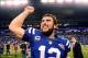 Jan 4, 2014; Indianapolis, IN, USA; Indianapolis Colts quarterback Andrew Luck (12) celebrates on the field after defeating the Kansas City Chiefs 45-44 to win the 2013 AFC wild card playoff football game at Lucas Oil Stadium. Mandatory Credit: Andrew Web
