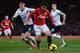MANCHESTER, ENGLAND - JANUARY 01: Shinji Kagawa of Manchester United competes with Vlad Chiriches of Tottenham Hotspur during the Barclays Premier League match between Manchester United and Tottenham Hotspur at Old Trafford on January 1, 2014 in Manchest