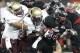 Nov 16, 2013; Jonesboro, AR, USA; Arkansas State Red Wolves running back Michael Gordon (34) rushes as Texas State Bobcats linebacker Michael Orakpo (1) attempts a tackle at ASU Stadium. Mandatory Credit: Nelson Chenault-USA TODAY Sports