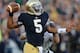 SOUTH BEND, IN - NOVEMBER 17: Everett Golson #5 of the Notre Dame Fighting Irish passes under pressure from Mike Olson #41 of the Wake Forest Demon Deacons at Notre Dame Stadium on November 17, 2012 in South Bend, Indiana. Notre Dame defeated Wake Forest