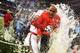NEW ORLEANS, LA - JANUARY 02: The Gatorade bucket is dumped on head coach Charlie Strong of the Louisville Cardinals after their 33 to 23 win over the Florida Gators in the Allstate Sugar Bowl at Mercedes-Benz Superdome on January 2, 2013 in New Orleans,