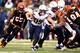 CINCINNATI, OH - JANUARY 05: Running back Danny Woodhead #39 of the San Diego Chargers carries the ball as middle linebacker Rey Maualuga #58 of the Cincinnati Bengals defends during a Wild Card Playoff game at Paul Brown Stadium on January 5, 2014 in Ci