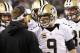 Jan 4, 2014; Philadelphia, PA, USA; New Orleans Saints quarterback Drew Brees (9) talks with Saints head coach Sean Payton (L) on the sidelines during a timeout against the Philadelphia Eagles in the fourth quarter during the 2013 NFC wild card playoff fo