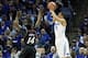 Jan 4, 2014; Memphis, TN, USA; Memphis Tigers guard Michael Dixon Jr (11) shoots over Cincinnati Bearcats guard Ge'Lawn Guyn (14) at FedExForum. Mandatory Credit: Nelson Chenault-USA TODAY Sports