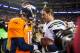 DENVER, CO - DECEMBER 12: Quarterback Peyton Manning #18 of the Denver Broncos congratulates quarterback Philip Rivers #17 of the San Diego Chargers after a 27-20 loss to the San Diego Chargers at Sports Authority Field Field at Mile High on December 12,