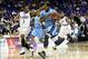 Jan 4, 2014; Baton Rouge, LA, USA; RRhode Island Rams forward Hassan Martin (12) is defended by LSU Tigers guard Anthony Hickey (1) as he drives the ball down court in the first half against the LSU Tigers at the Pete Maravich Assembly Center. Mandatory C