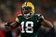 GREEN BAY, WI - JANUARY 05: Randall Cobb #18 of the Green Bay Packers celebrates after a first down catch in the fourth quarter against the San Francisco 49ers during their NFC Wild Card Playoff game at Lambeau Field on January 5, 2014 in Green Bay, Wisc