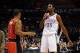 Dec 22, 2013; Oklahoma City, OK, USA; Oklahoma City Thunder small forward Kevin Durant (35) talks to Toronto Raptors point guard Kyle Lowry (7) after hitting a 3 point shot during the third quarter at Chesapeake Energy Arena. Mandatory Credit: Mark D. Smi