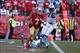 Nov 10, 2013; San Francisco, CA, USA; San Francisco 49ers quarterback Colin Kaepernick (7) escapes Carolina Panthers defensive end Charles Johnson (95) and defensive end Greg Hardy (76) during the fourth quarter at Candlestick Park. The Carolina Panthers
