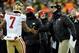 Jan 5, 2014; Green Bay, WI, USA; San Francisco 49ers head coach Jim Harbaugh congratulates quarterback Colin Kaepernick (7) after Kaepernick threw a 28-yard touchdown pass to tight end Vernon Davis (not pictured) in the 4th quarter during the 2013 NFC