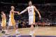 LOS ANGELES, CA - JANUARY 5: Robert Sacre #50 and Pau Gasol #16 of the Los Angeles Lakers celebrate during a game against the Denver Nuggets at STAPLES Center on January 5, 2014 in Los Angeles, California. NOTE TO USER: User expressly acknowledges and agr