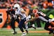 Jan 5, 2014; Cincinnati, OH, USA; San Diego Chargers running back Danny Woodhead (39) runs the ball away from Cincinnati Bengals linebacker Emmanuel Lamur (59) during third quarter of the AFC wild card playoff football game at Paul Brown Stadium. Mandator