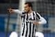 BERGAMO, ITALY - DECEMBER 22: Carlos Tevez of Juventus celebrates after scoring his team opening goal during the Serie A match between Atalanta BC and Juventus at Stadio Atleti Azzurri d'Italia on December 22, 2013 in Bergamo, Italy. (Photo by Maurizio