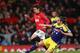 MANCHESTER, ENGLAND - JANUARY 05: Chico Flores of Swansea City challenges Shinji Kagawa of Manchester United during the FA Cup with Budweiser Third round match between Manchester United and Swansea City at Old Trafford on January 5, 2014 in Manchester, E