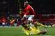 MANCHESTER, ENGLAND - JANUARY 01: Hugo Lloris of Tottenham Hotspur collides with Ashley Young of Manchester United during the Barclays Premier League match between Manchester United and Tottenham Hotspur at Old Trafford on January 1, 2014 in Manchester,