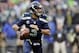 Dec 22, 2013; Seattle, WA, USA; Seattle Seahawks quarterback Russell Wilson (3) looks looks for an open receiver during the first half against the Arizona Cardinals at CenturyLink Field. Mandatory Credit: Steven Bisig-USA TODAY Sports