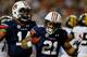 ATLANTA, GA - DECEMBER 07: Tre Mason #21 of the Auburn Tigers celebrates his second quarter touchdown with teammate quarterback Nick Marshall #14 against the Missouri Tigers during the SEC Championship Game at Georgia Dome on December 7, 2013 in Atlanta,