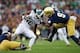 Sep 21, 2013; South Bend, IN, USA; Notre Dame Fighting Irish cornerback KeiVarae Russell (6) and linebacker Jaylon Smith (9) tackle Michigan State Spartans wide receiver Aaron Burbridge (16) in the fourth quarter at Notre Dame Stadium. Notre Dame won 17-1