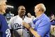 Oct 7, 2013; Los Angeles, CA, USA; Los Angeles Dodgers third baseman Juan Uribe (5) with owners Mark Walters and Stan Kasten after defeating the Atlanta Braves 3-2 in game four of the National League divisional series at Dodger Stadium. Dodgers won 3-2.