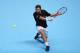 LONDON, ENGLAND - NOVEMBER 08: Stanislas Wawrinka of Switzerland hits a backhand in his men's singles match against David Ferrer of Spain during day five of the Barclays ATP World Tour Finals at O2 Arena on November 8, 2013 in London, England. (Photo by