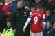 WIGAN, ENGLAND - DECEMBER 22: Lukas Podolski of Arsenal is substituted as Arsenal Manager Arsene Wenger looks on during the Barclays Premier League match between Wigan Athletic and Arsenal at the DW Stadium on December 22, 2012 in Wigan, England. (Photo