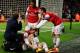 LONDON, ENGLAND - JANUARY 01: An injured Nicklas Bendtner of Arsenal is congratulated by team mates Theo Walcott (2L) and Nacho Monreal (R) as he scores their first goal during the Barclays Premier League match between Arsenal and Cardiff City at Emirate