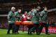 LONDON, ENGLAND - JANUARY 04: The injured Theo Walcott of Arsenal makes a 2-0 gesture to the Tottenham fans as he is stretchered off the pitch during the Budweiser FA Cup third round match between Arsenal and Tottenham Hotspur at Emirates Stadium on Janu