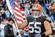 Nov 3, 2013; Cleveland, OH, USA; Cleveland Browns center Alex Mack (55) runs onto the field with an American flag before the game against the Baltimore Ravens at FirstEnergy Stadium. Mandatory Credit: Ken Blaze-USA TODAY Sports