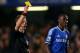 LONDON, ENGLAND - DECEMBER 26: Referee Michael Jones shows Ramires of Chelsea a yellow card during the Barclays Premier League match between Chelsea and Swansea City at Stamford Bridge on December 26, 2013 in London, England. (Photo by Warren Little/Get