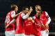 LONDON, ENGLAND - DECEMBER 04: Mesut Oezil of Arsenal celebrates his goal with team mates during the Barclays Premier League match between Arsenal and Hull City at Emirates Stadium on December 4, 2013 in London, England. (Photo by Jamie McDonald/Getty I