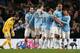 MANCHESTER, ENGLAND - DECEMBER 28: Edin Dzeko of Manchester City is congratulated by his team-mates after scoring the opening goal during the Barclays Premier League match between Manchester City and Crystal Palace at the Etihad Stadium on December 28, 2