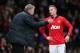 MANCHESTER, ENGLAND - JANUARY 05: Manchester United Manager David Moyes gives instructions to Alexander Buttner during the FA Cup with Budweiser Third round match between Manchester United and Swansea City at Old Trafford on January 5, 2014 in Manchester