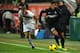 MILAN, ITALY - DECEMBER 04: Fredy Guarin (R) of FC Internazionale Milano in action against Giusto Priola of Trapani Calcio during the Tim Cup match between FC Internazionale Milano and Trapani Calcio at Stadio Giuseppe Meazza on December 4, 2013 in Milan