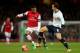 LONDON, ENGLAND - JANUARY 04: Serge Gnabry of Arsenal and Vlad Chiriches of Spurs compete for the ball during the Budweiser FA Cup third round match between Arsenal and Tottenham Hotspur at Emirates Stadium on January 4, 2014 in London, England. (Photo