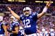 INDIANAPOLIS, IN - JANUARY 04: Quarterback Andrew Luck #12 of the Indianapolis Colts celebrates a fourth quarter touchdown against the Kansas City Chiefs during a Wild Card Playoff game at Lucas Oil Stadium on January 4, 2014 in Indianapolis, Indiana. (