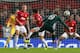 MANCHESTER, ENGLAND - MARCH 05: Luka Modric of Real Madrid scores his team's first goal during the UEFA Champions League Round of 16 Second leg match between Manchester United and Real Madrid at Old Trafford on March 5, 2013 in Manchester, United Kingdom